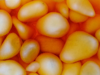 Orange pebbles covered with plastic resin