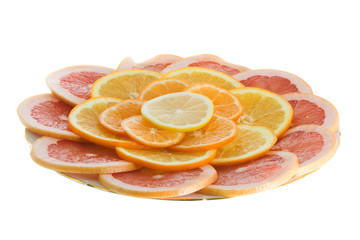 Citrus slices on a plate isolated on white