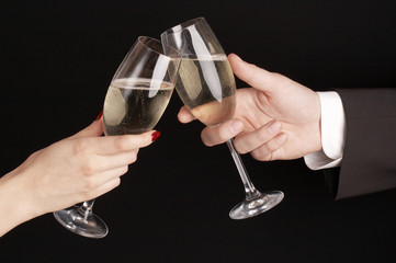 man and woman celebrating with Champagne, toast, party time