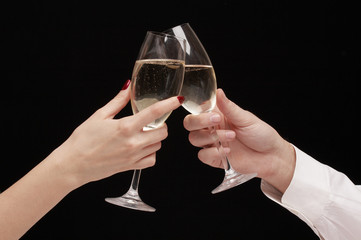 man and woman celebrating with Champagne, toast, party time