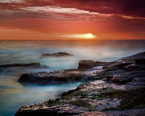 Fototapeta na wymiar Sunrise on East Coast of Australia, with ship on the horizon