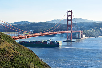 Cargo ship under the Golden Gate Bridge.