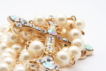 Pearls with golden cross