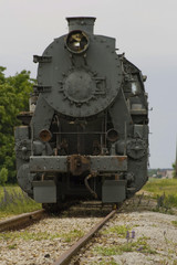 Fototapeta na wymiar The broken old steam locomotive