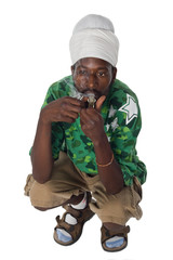 portrait of rasta man smoking marijuana from a pipe