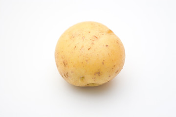 Single golden Idaho potato set against a white background.