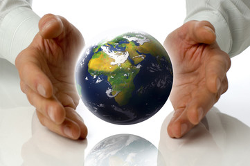 business men holding earth between hands on white