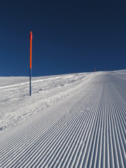Ski slope in a winter bright day