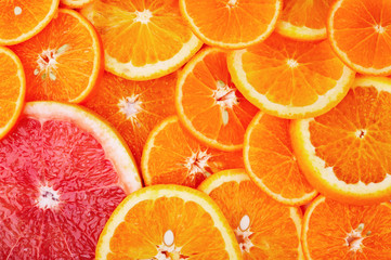 Background of sliced oranges and grapefruit