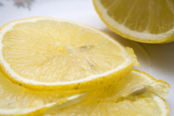 Macro close-up of fresh slices of lemon as background