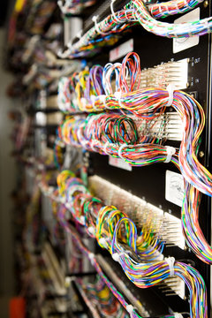 A rack of computer hardware connected in wires