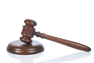 Wooden gavel from the court reflected on white background