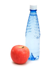 Health concept with bottle and apple on white