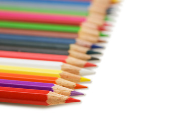 Row of colourful pencils isolated on the white