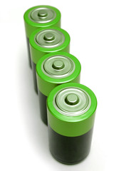 Four green batteries on white background.