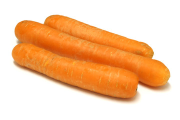 Three bright carrots on a white background