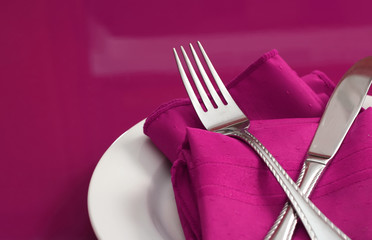 An elegant holiday table setting in pink