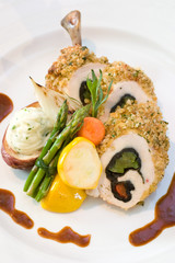 Breaded chicken slices stuffed with sweet peppers 