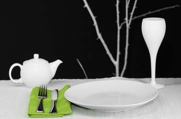 A modern dinner table set for one