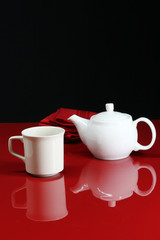 A red kitchen table set for tea time