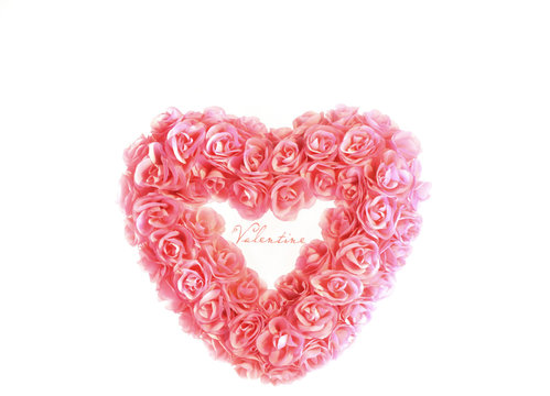 Heart with tiny pink roses isolated on white background
