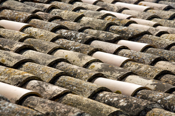 roof from a Spanish villa typical roofing tiles, blue sky)