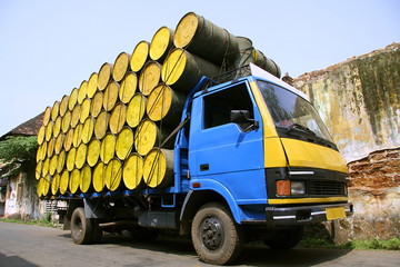 barrels stacked atop truck, south india