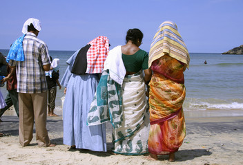 family at the beach, kerala, india