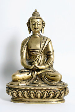 bronze sculpture of buddha on display