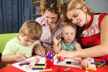 children painting with his mothers