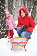 mother with child in park at winter 2