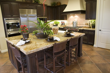 Modern Kitchen with brown tiles.