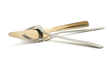 Silver Cutlery Hugging Gold Knife