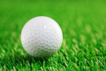 Golf ball against grass background
