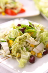 Fresh salad with corn and basil