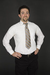 Caucasian businessman standing with his hands on hips 