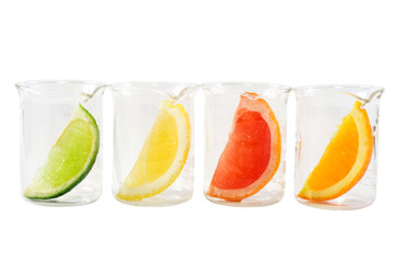 Colorful citrus slices in a row of chemical research recipients