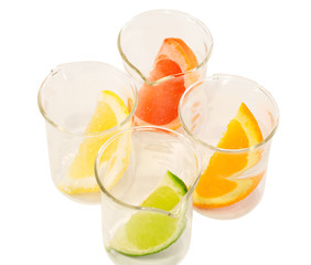 Colorful citrus slices in chemical research recipients