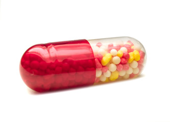 medical capsules isolated over white. shallow dof