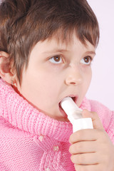 Kid with inhaler do medicine procedure