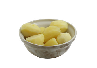 Boiled potatoes in crockery tureen on white background