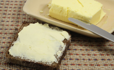 Bread and butter with knife and butterdish