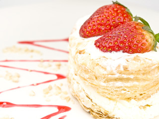 Cake of strawberries with cream and puff-pastry