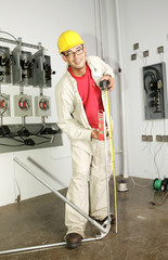Electrician bending conduit pipe on the job.  