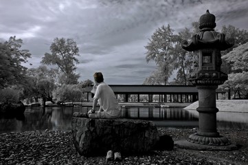 infrared photo - lake, man and rock in the parks