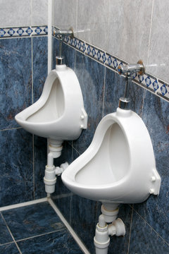 Two pissoirs from a public restroom.