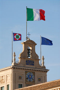 italian flag blowing in the wind on the palazzo del quirinale