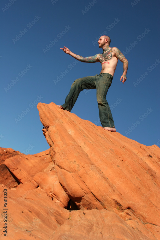 Wall mural Male model with tattoos on his body