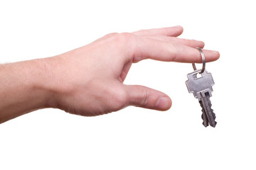 male hand with hanging house key on finger isolated on white