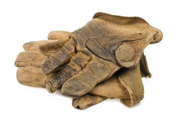 A pair of well worn leather rancher style leather work gloves